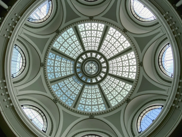 a dome type ceiling in the lobby of a building