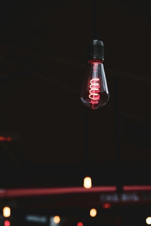 an orange light bulb with a red light inside