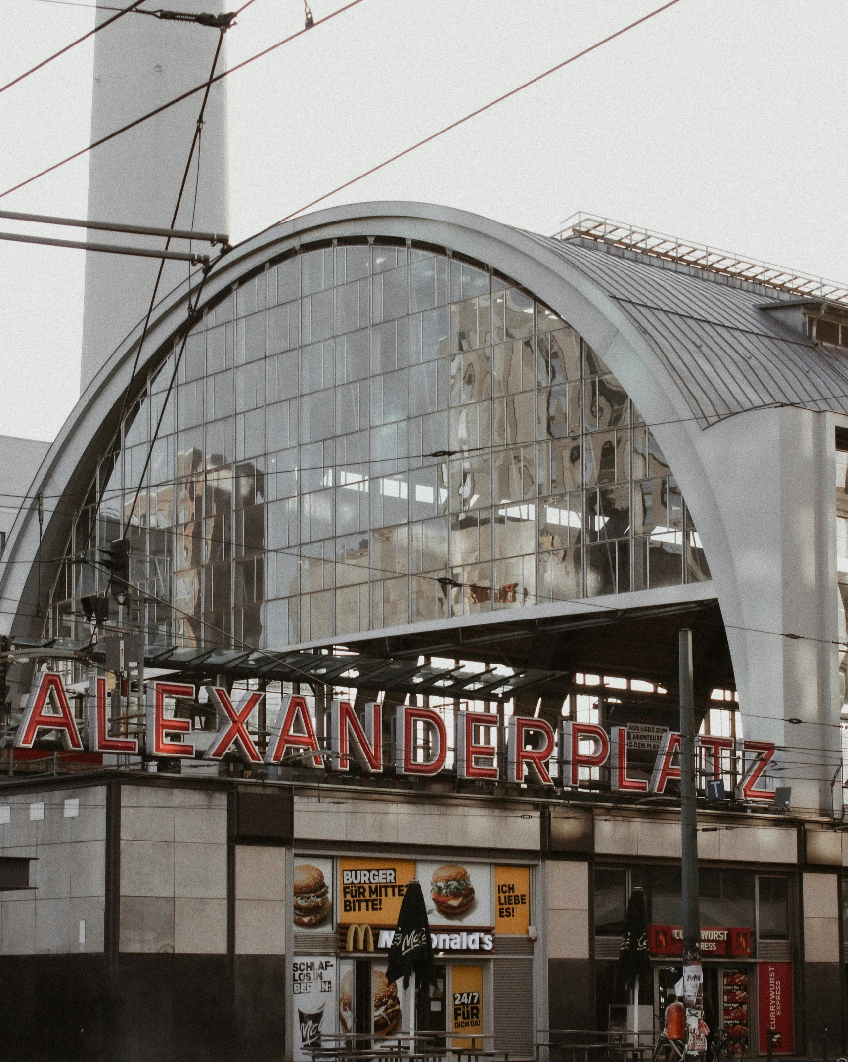 the entrance to an old train station with a large sign