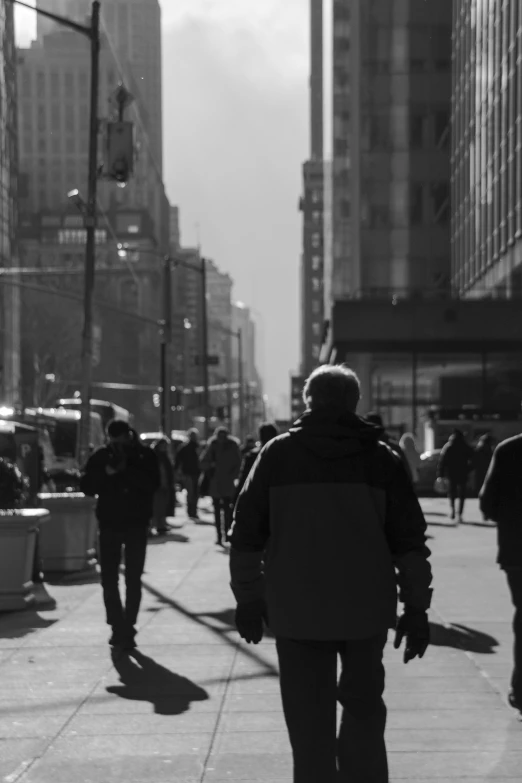 a person walking down a street in the city