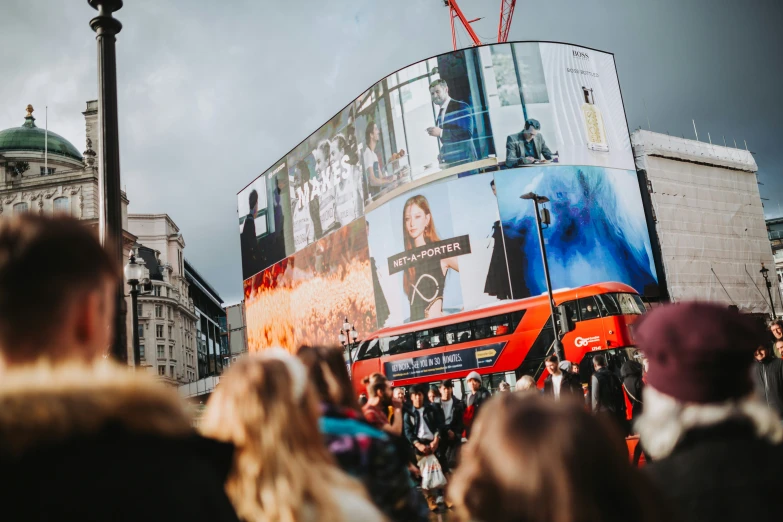 the large bus is traveling on the street