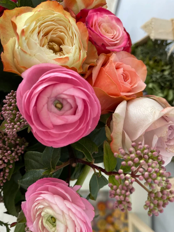 a bouquet of beautiful multi - colored flowers in a vase