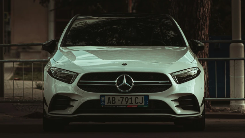 a mercedes benz c class with its hood open