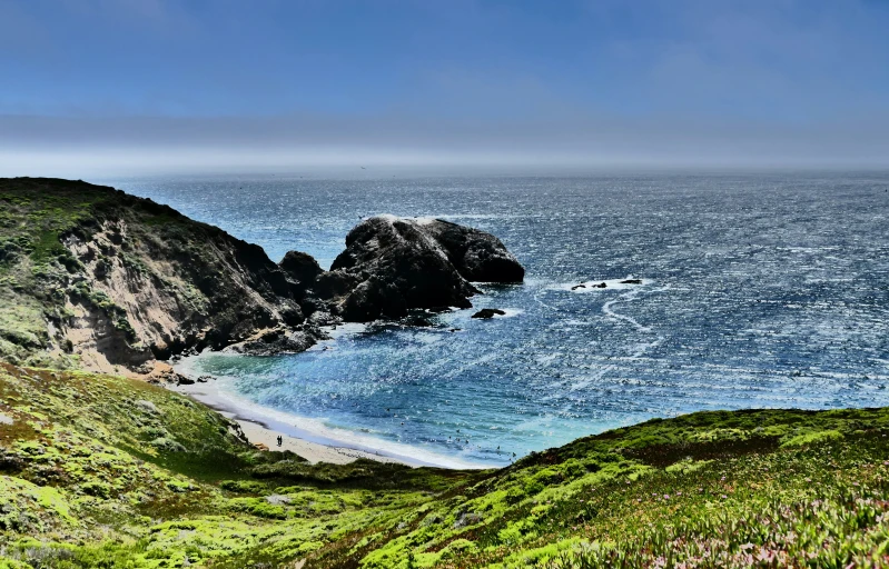 an ocean view with an island in the background