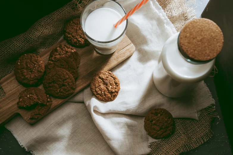 there are cookies and milk on the table