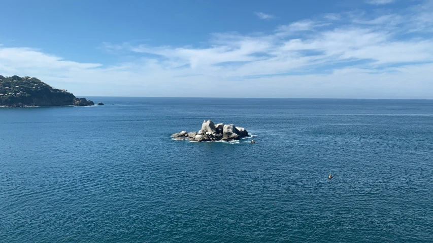 an island near the water, surrounded by other land