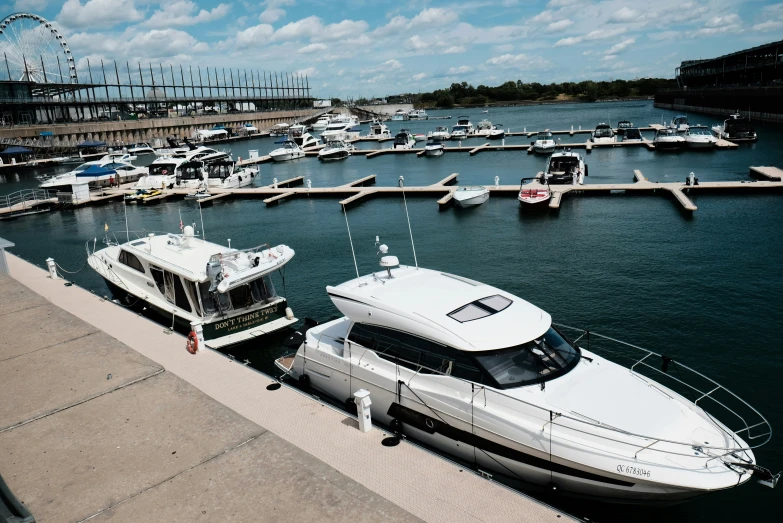 two boats are parked next to each other in a harbor