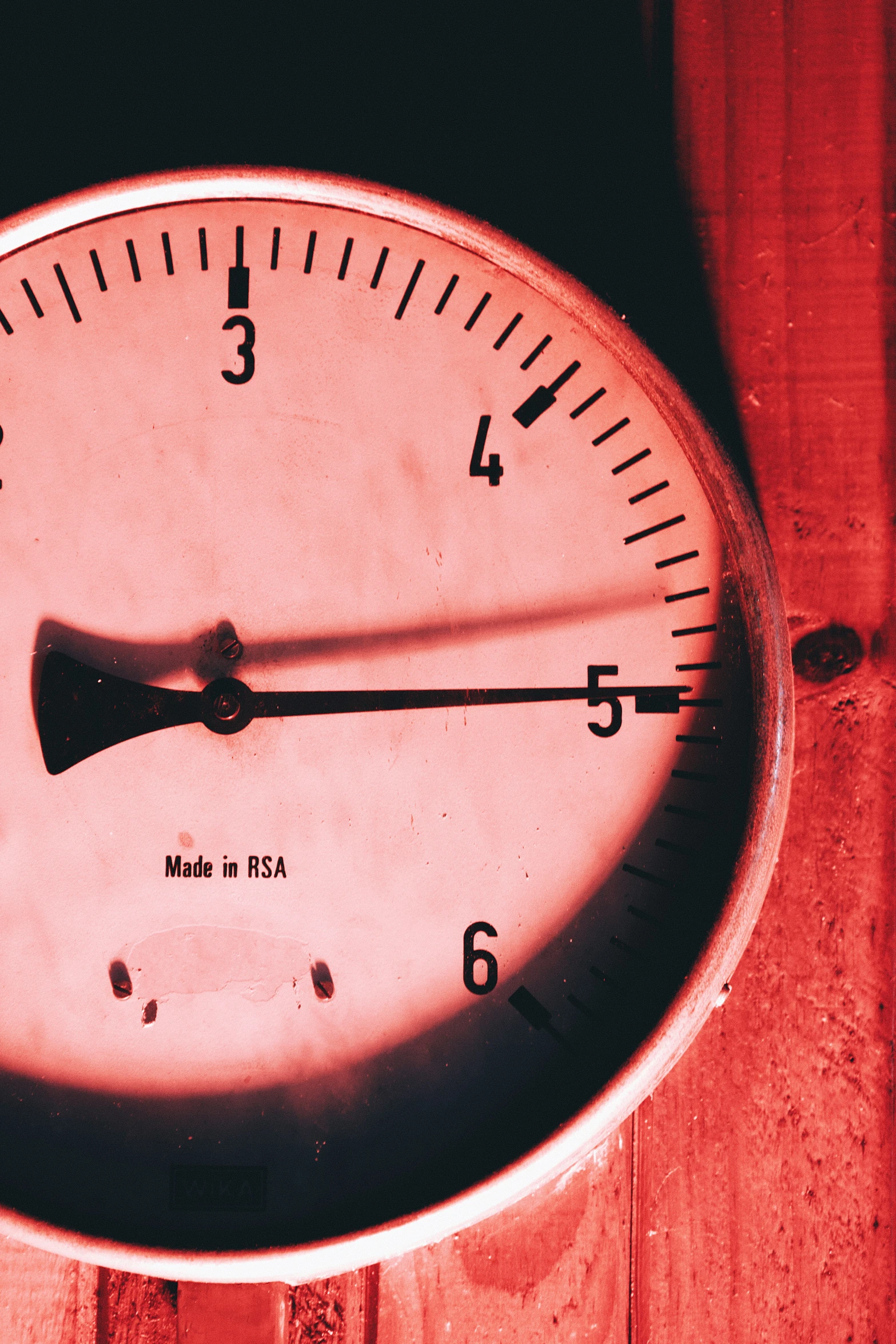 there is a close up of a red and white clock