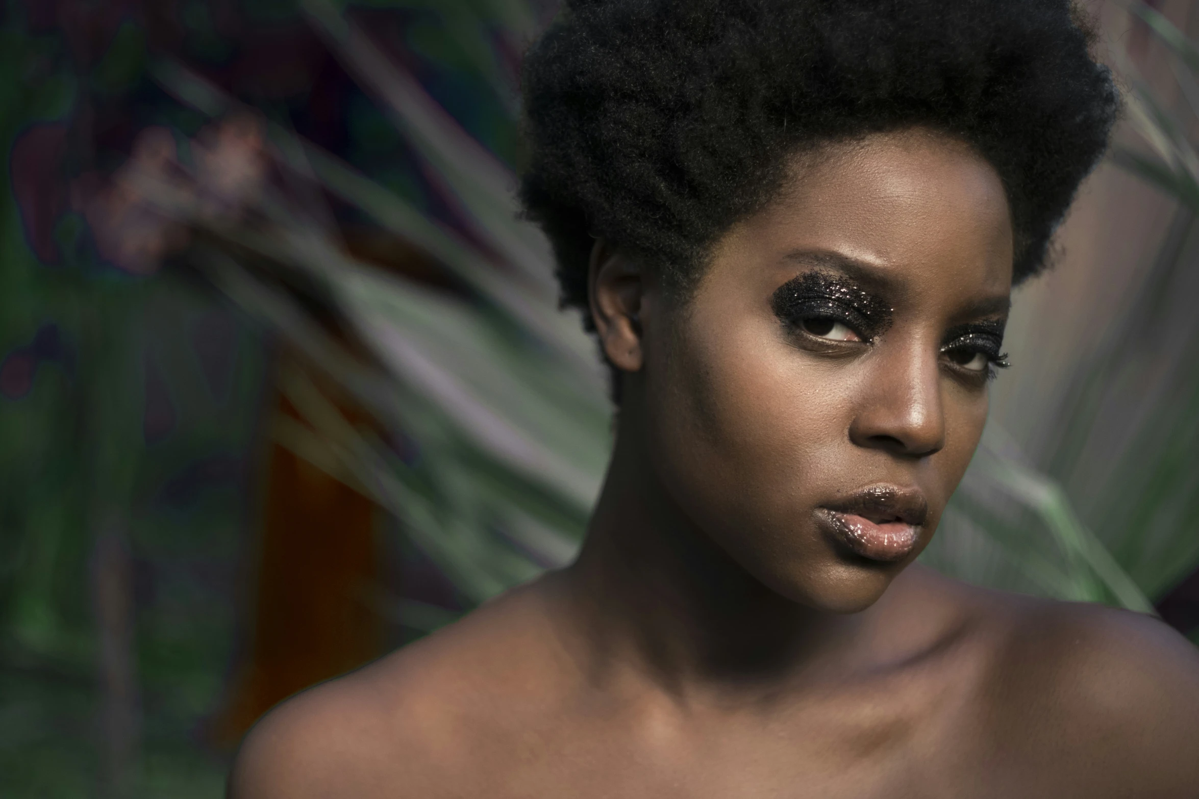 a close up image of a young woman with natural hair