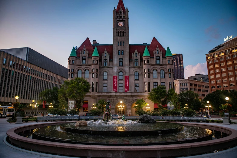 the fountain in front of the big building is very large