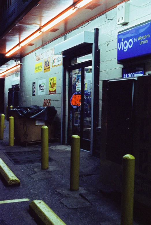 a building has orange and yellow poles in front of it