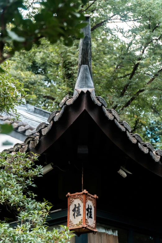 an asian clock on the front of a building