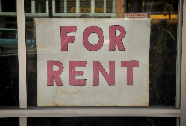 a for rent sign in a window