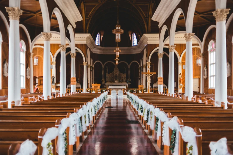 an interior of a church with a bunch of pews