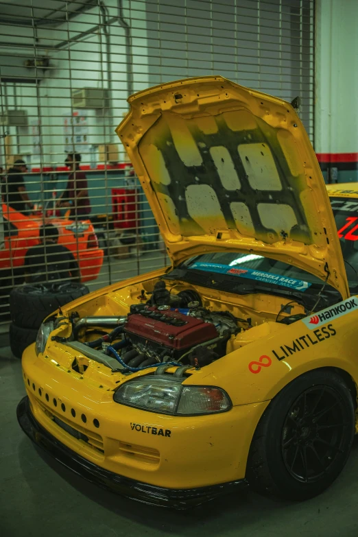 a yellow car is parked in an area