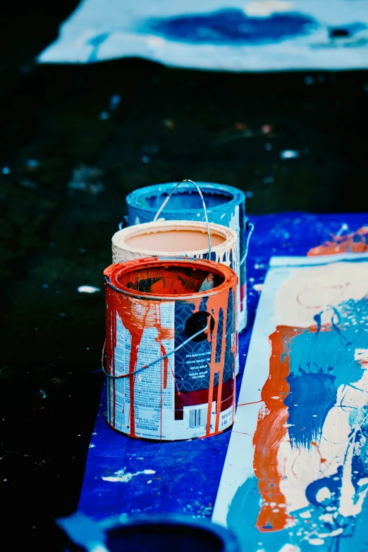 a close up of a paint can with an orange smudge