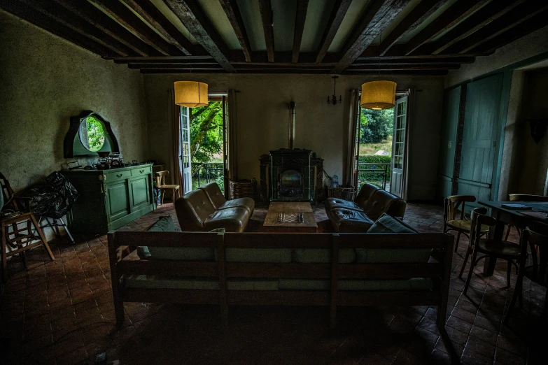 a living room with a wood floor and lots of furniture