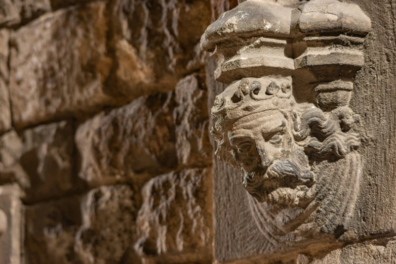 an intricate sculpture made to look like a head with a crown