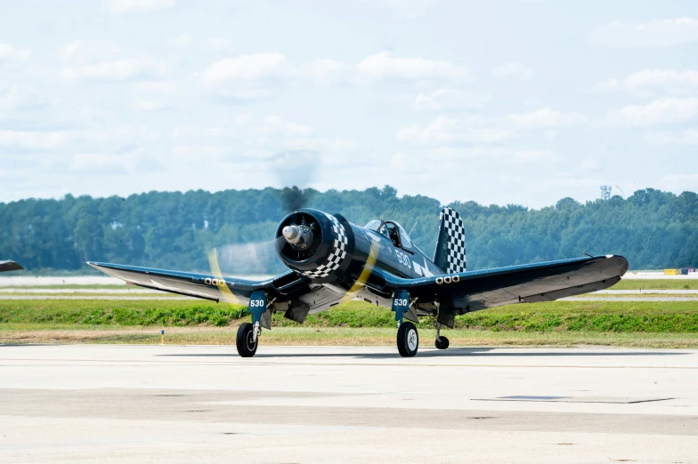 an airplane with its propeller is on the runway