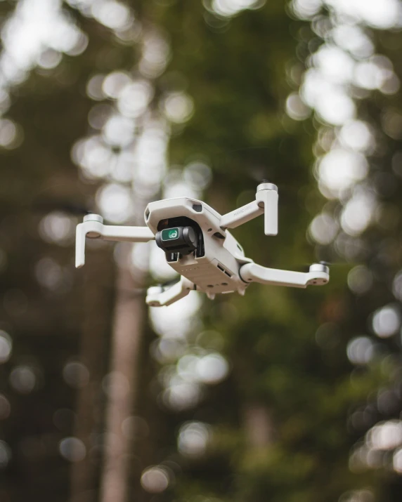 a close up of a white camera and an aerial object