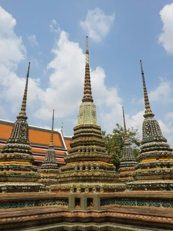 several different sized buildings with spires towering in the sky