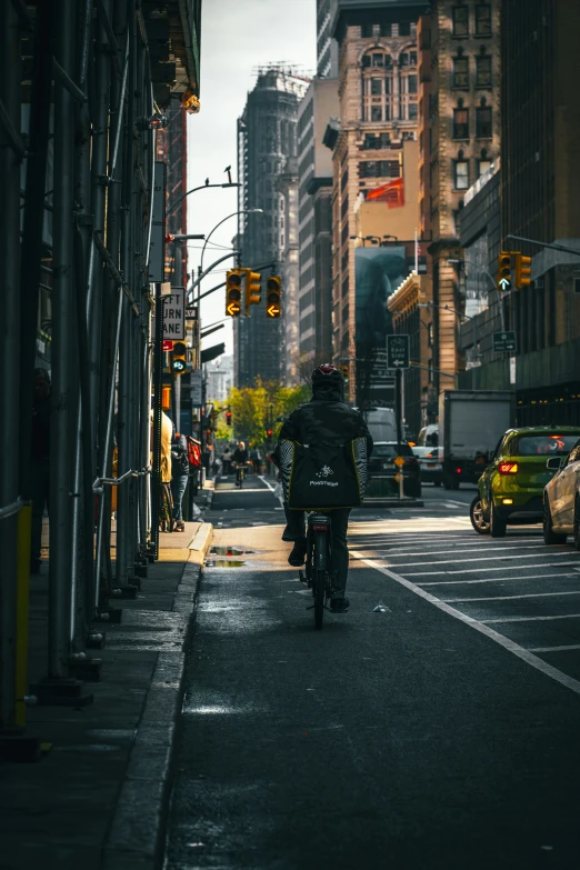 a person on a motorcycle driving down the road