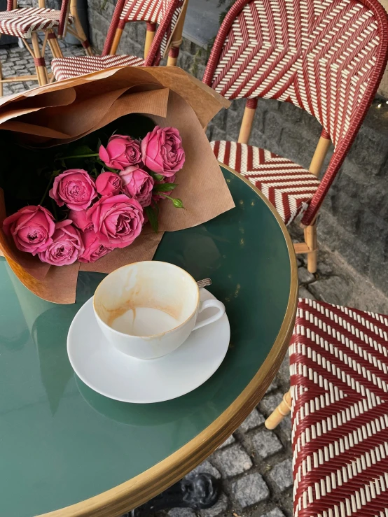 a table topped with a white plate with lots of flowers