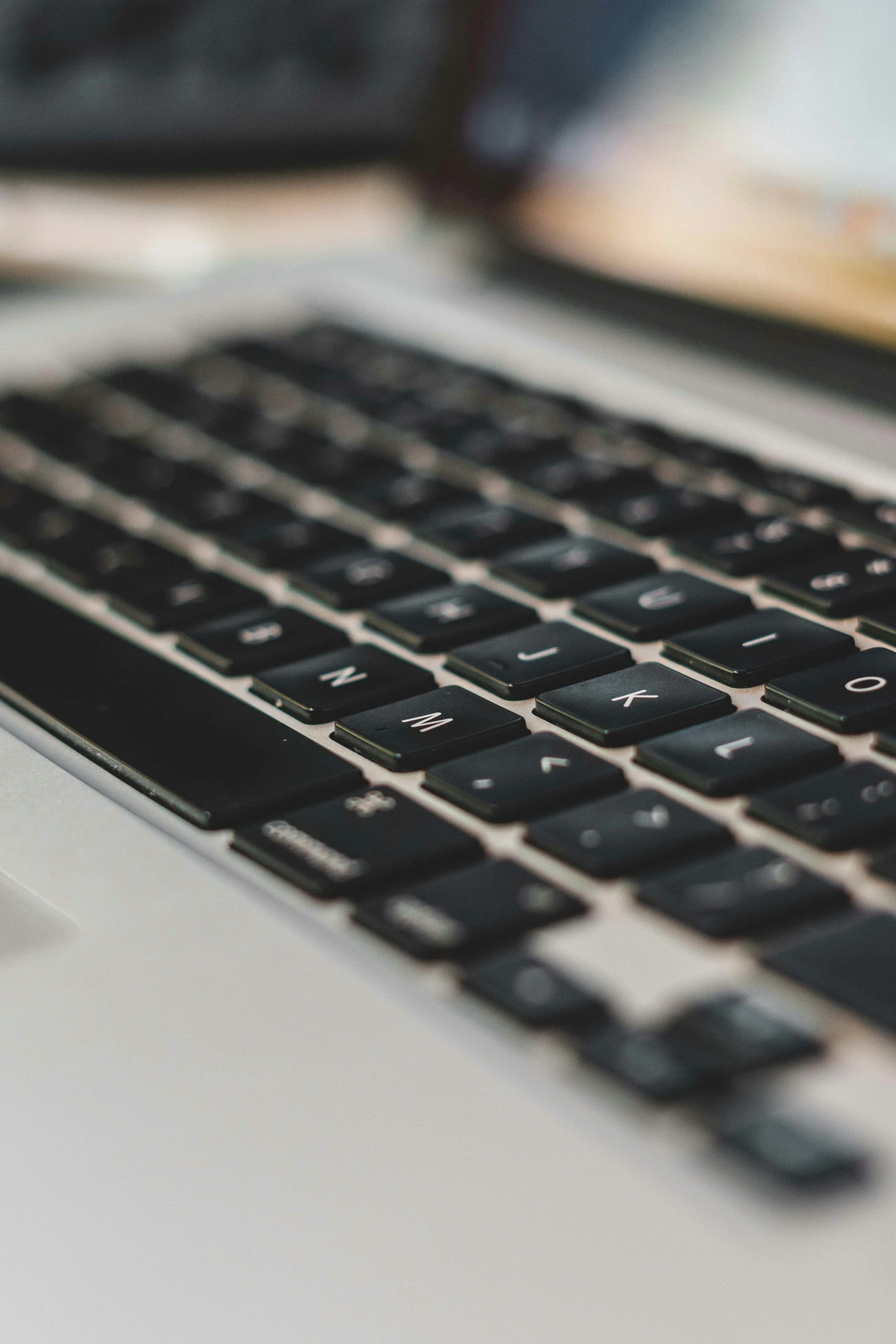 the keyboard of a black and white computer is shown