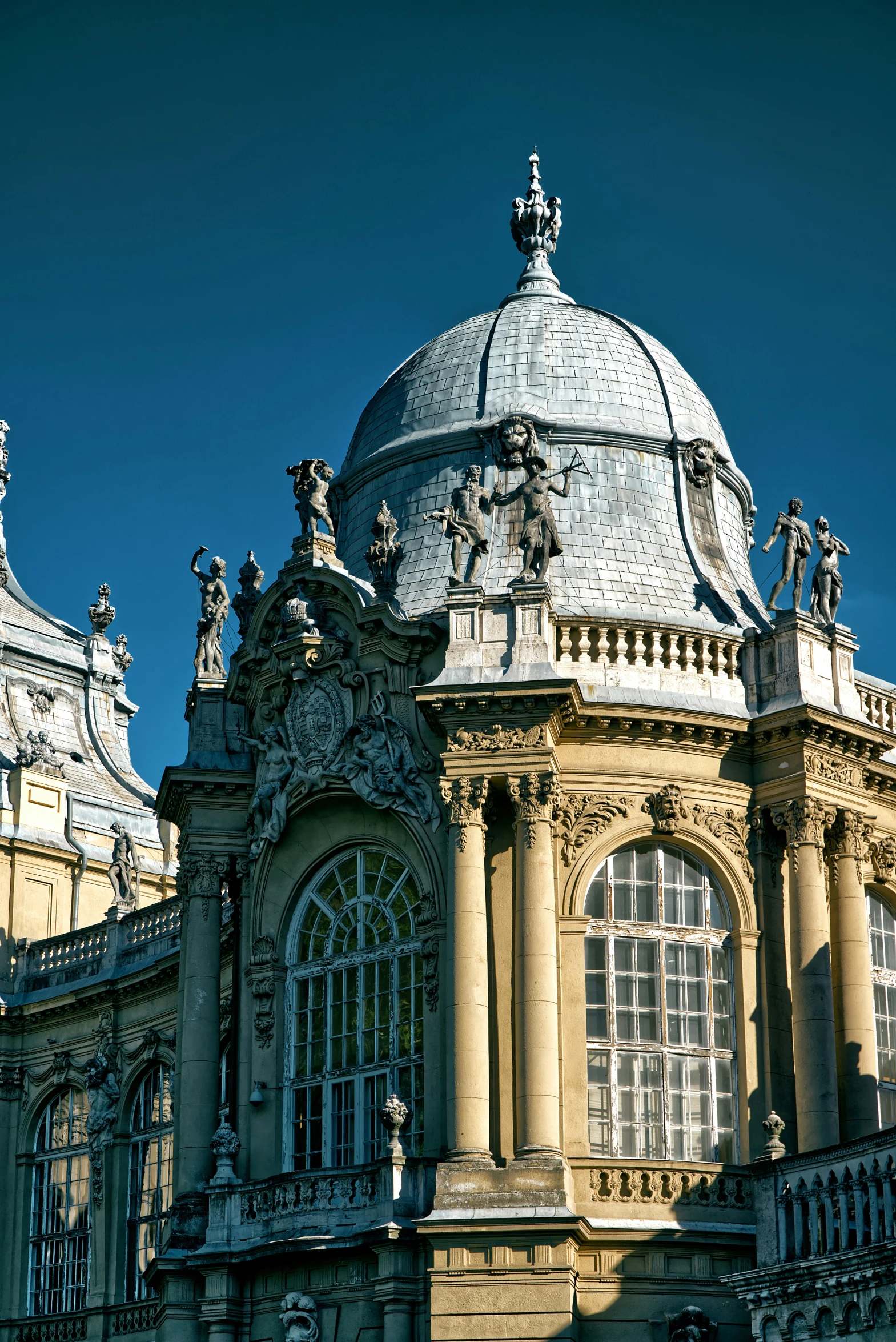 a domed building with ornate architecture on a sunny day