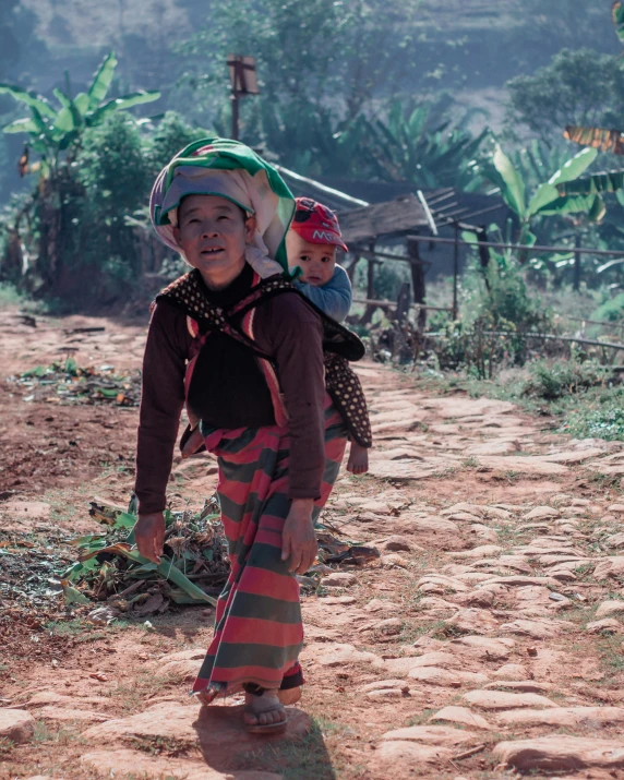 the two children are carrying things on their back