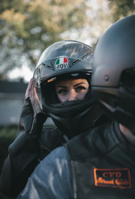 an image of two people wearing motor bikes helmets