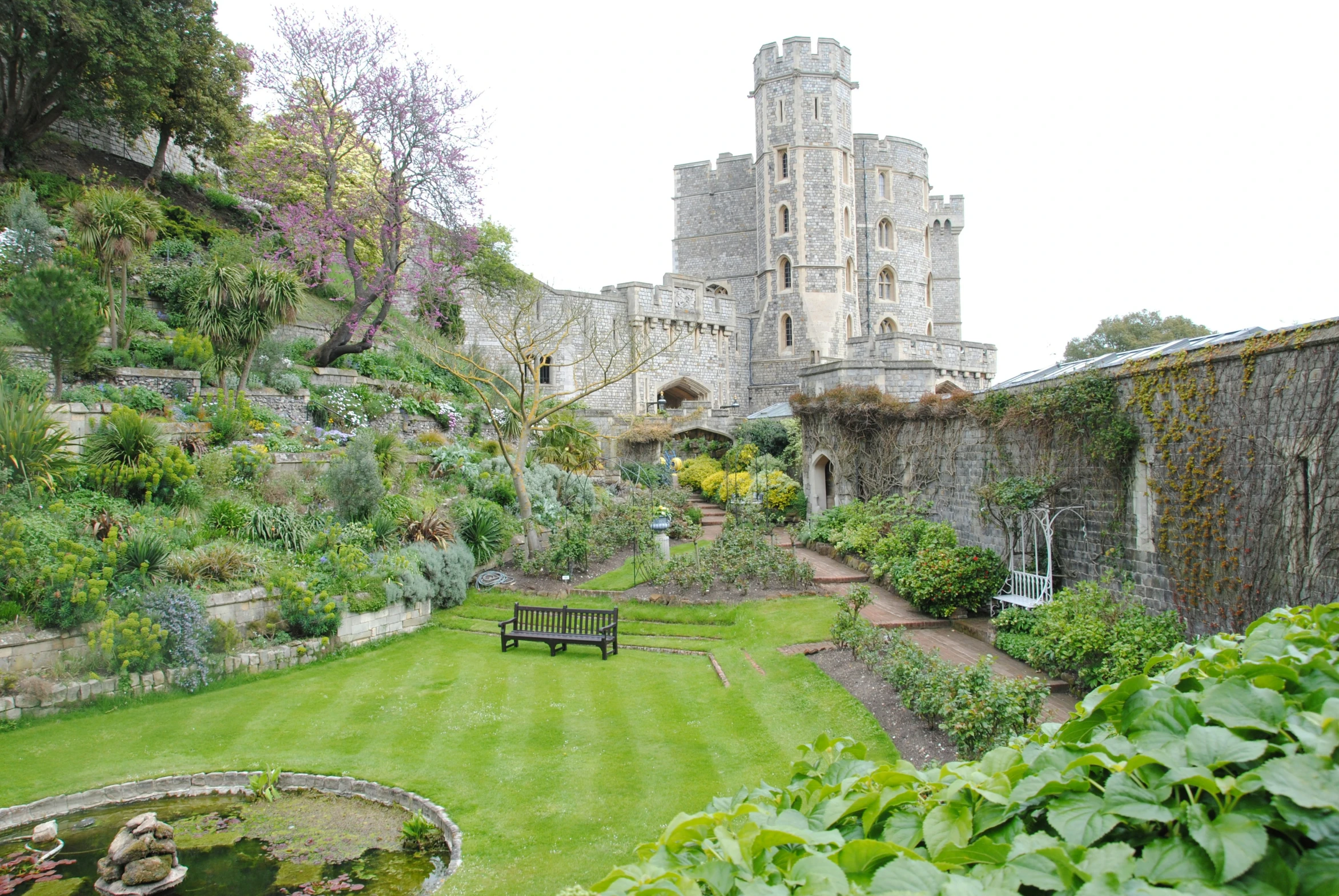 a garden and garden area in front of a castle