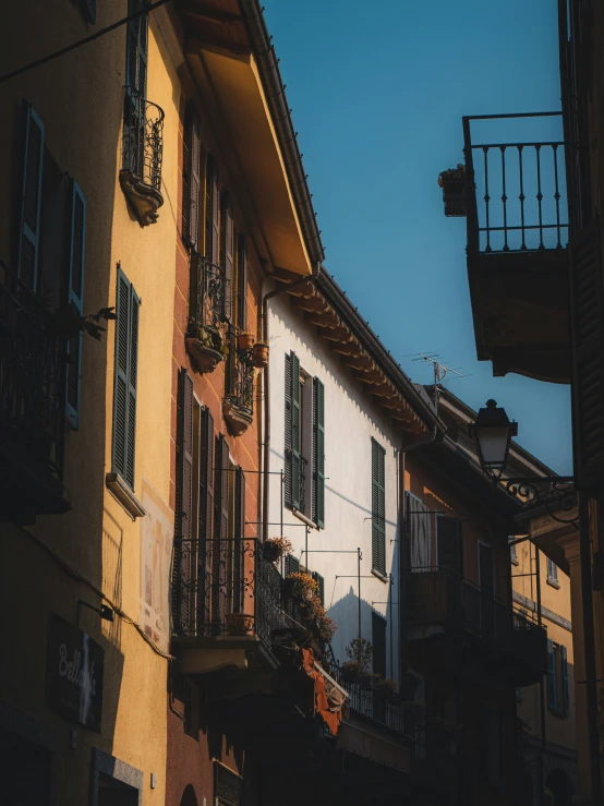 the view down a street with different types of balconyes