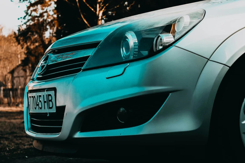 a close up po of the front of a parked car