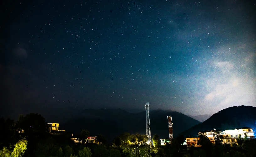 night view of mountains, cellphones and buildings