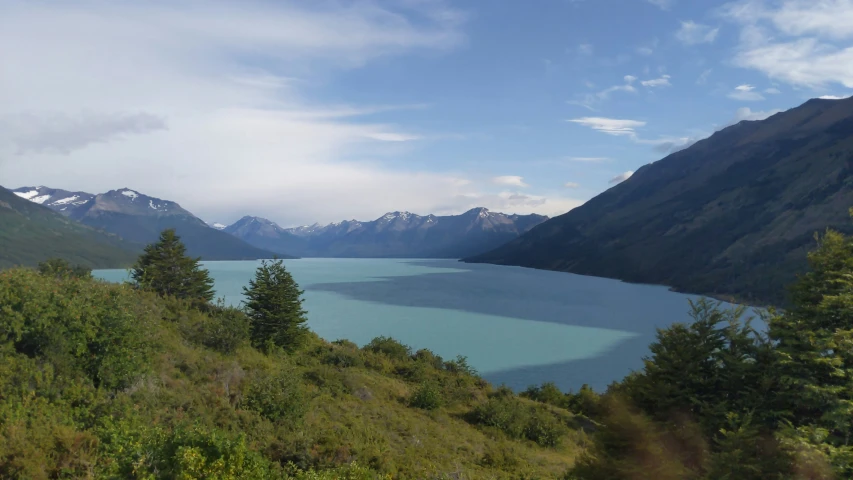 an image of a mountain lake in the middle of a field