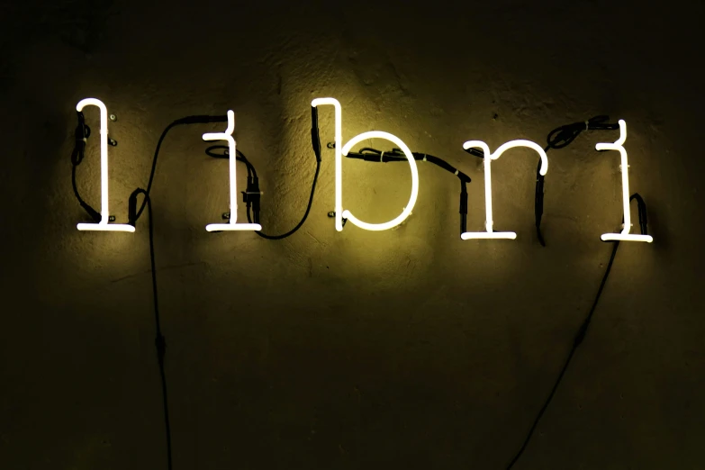 a bright neon sign reading frank and iron