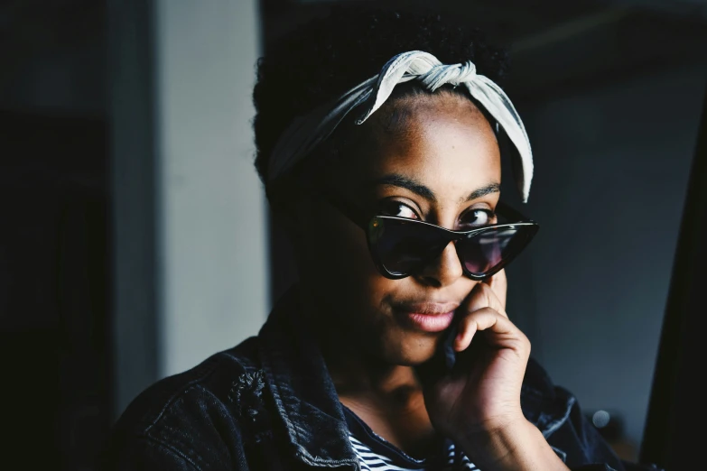 a close up of a person wearing sunglasses