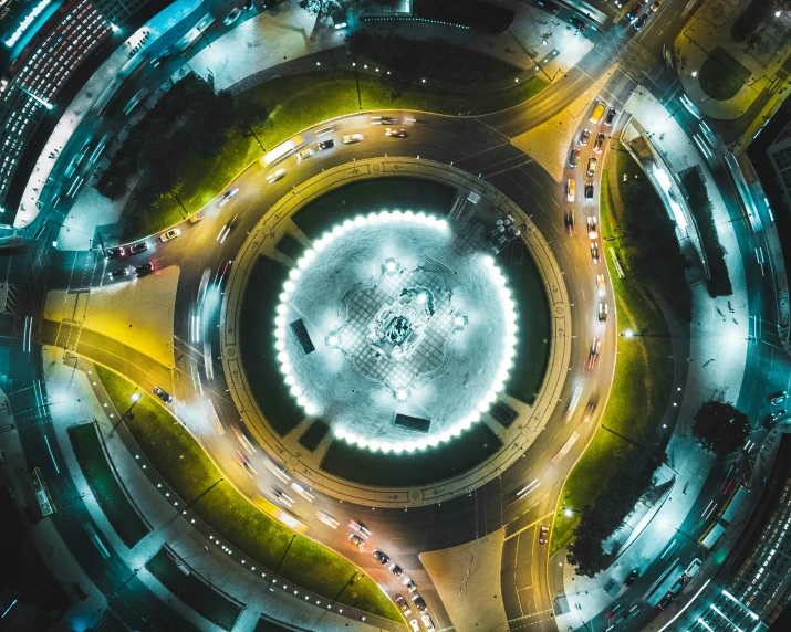 a busy city street at night with lights