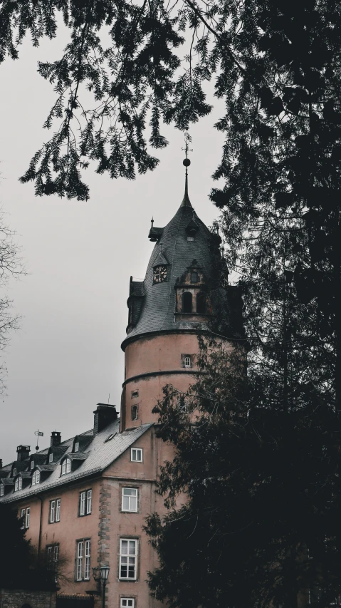 the old tower is surrounded by the trees