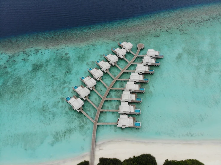 a beach filled with boats on top of the water