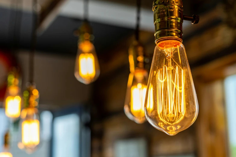 a number of light bulbs hanging from strings