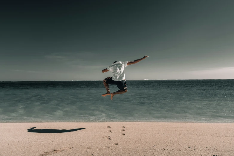 a man flying through the air while riding a skateboard