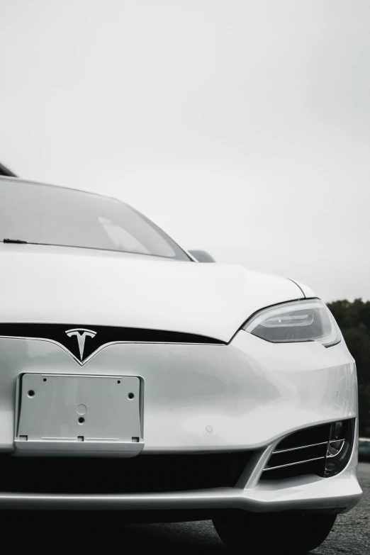 black and white image of the front of an electric car