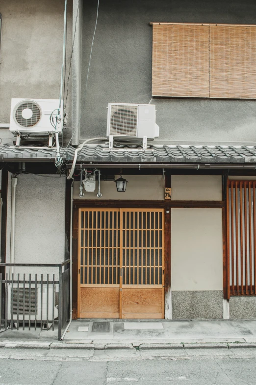 an air conditioner sits in the middle of a courtyard of a building