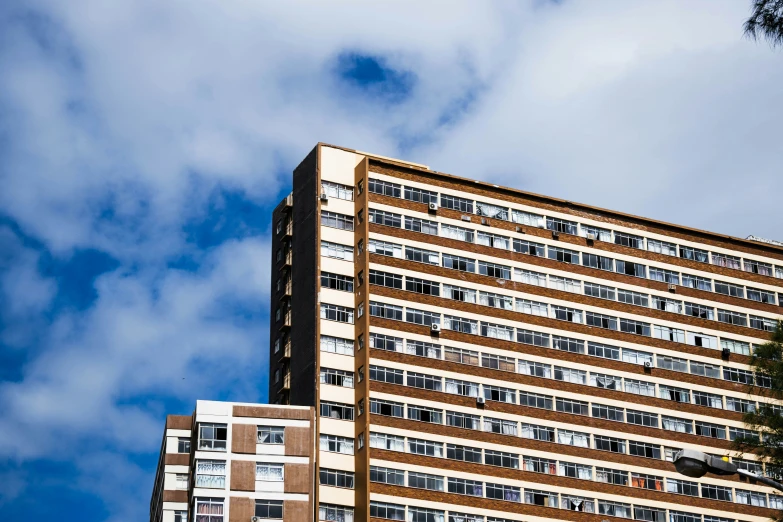 an office building is shown against a blue sky