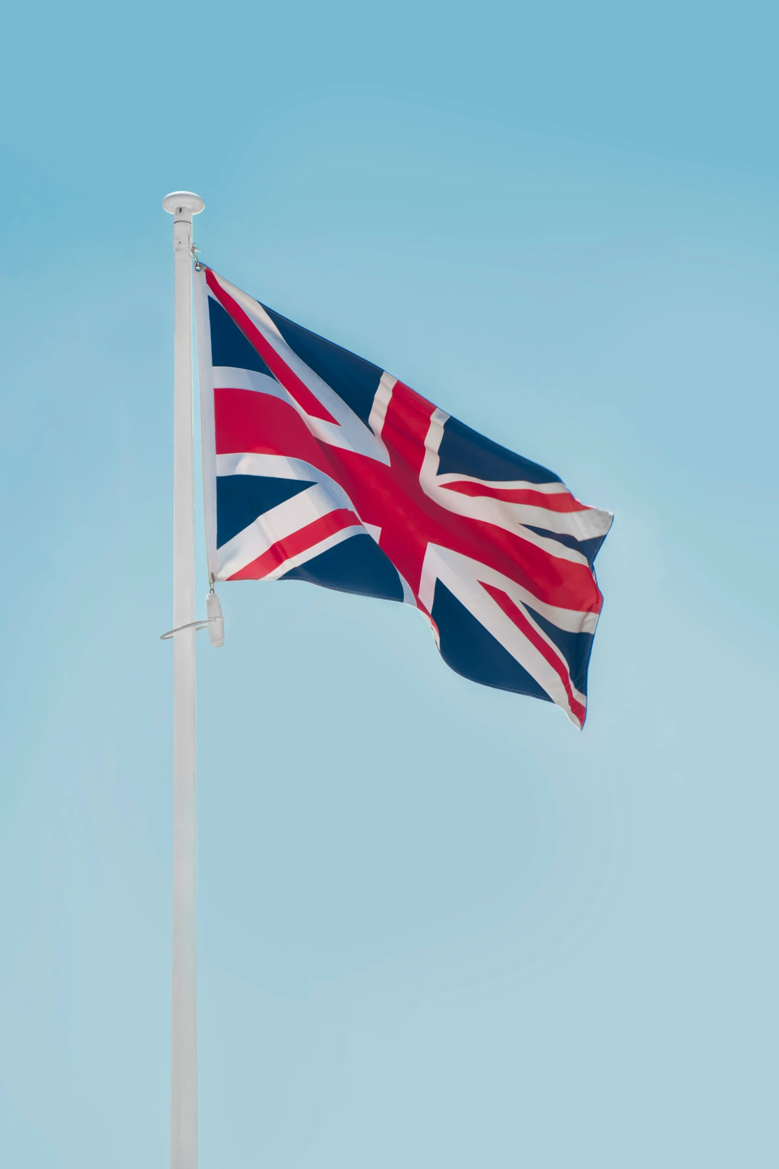 a flag flying on top of a flag pole