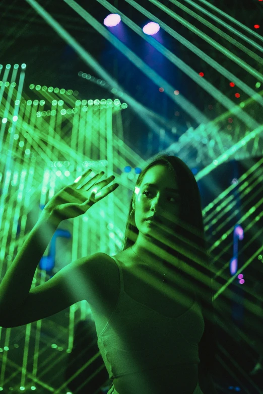 a woman in front of an array of lights