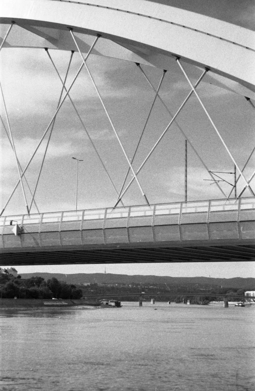 a bridge crosses the water under an overpass