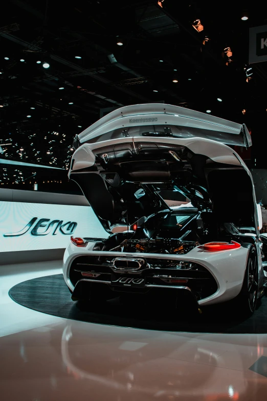 the back end of a car on display at an automobile show